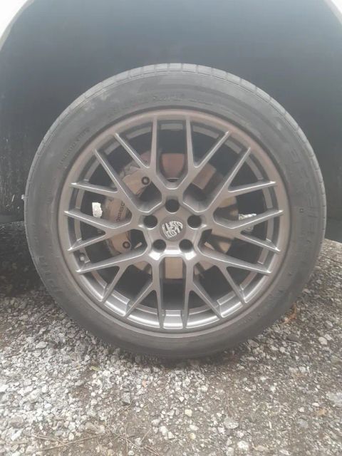 A gunmetal mesh wheel, close up