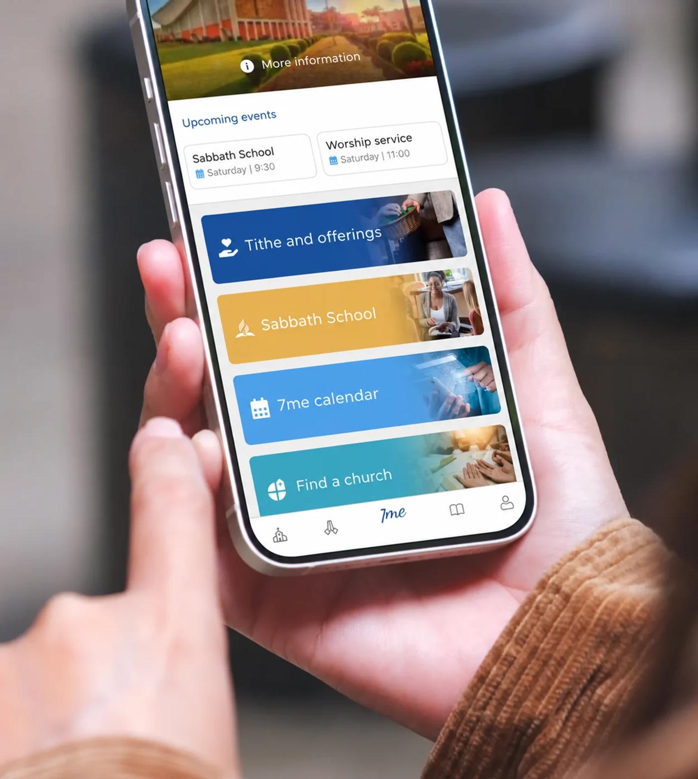 A hand holding a phone with 7me · English screen
