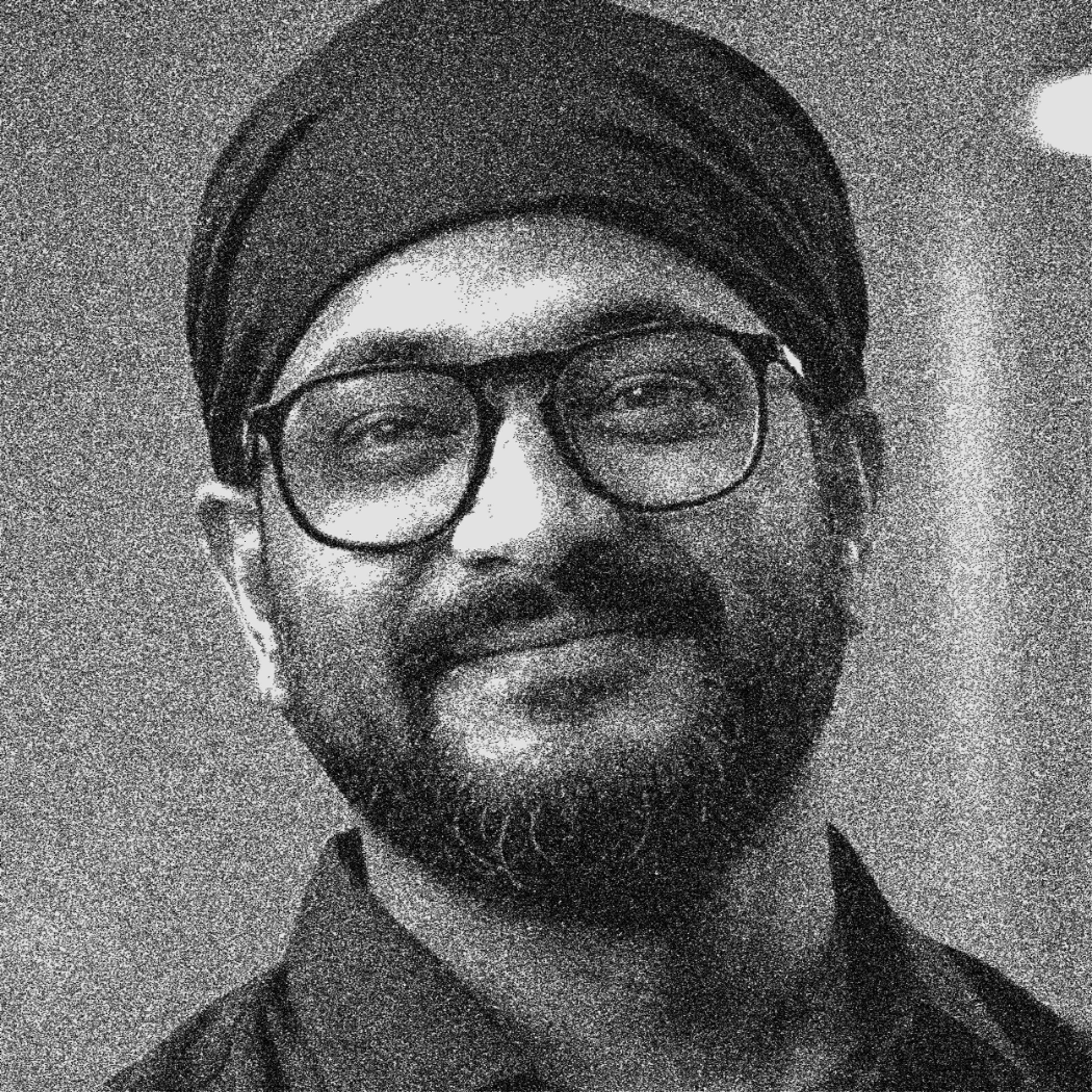 black and white photo of Manish Kumar