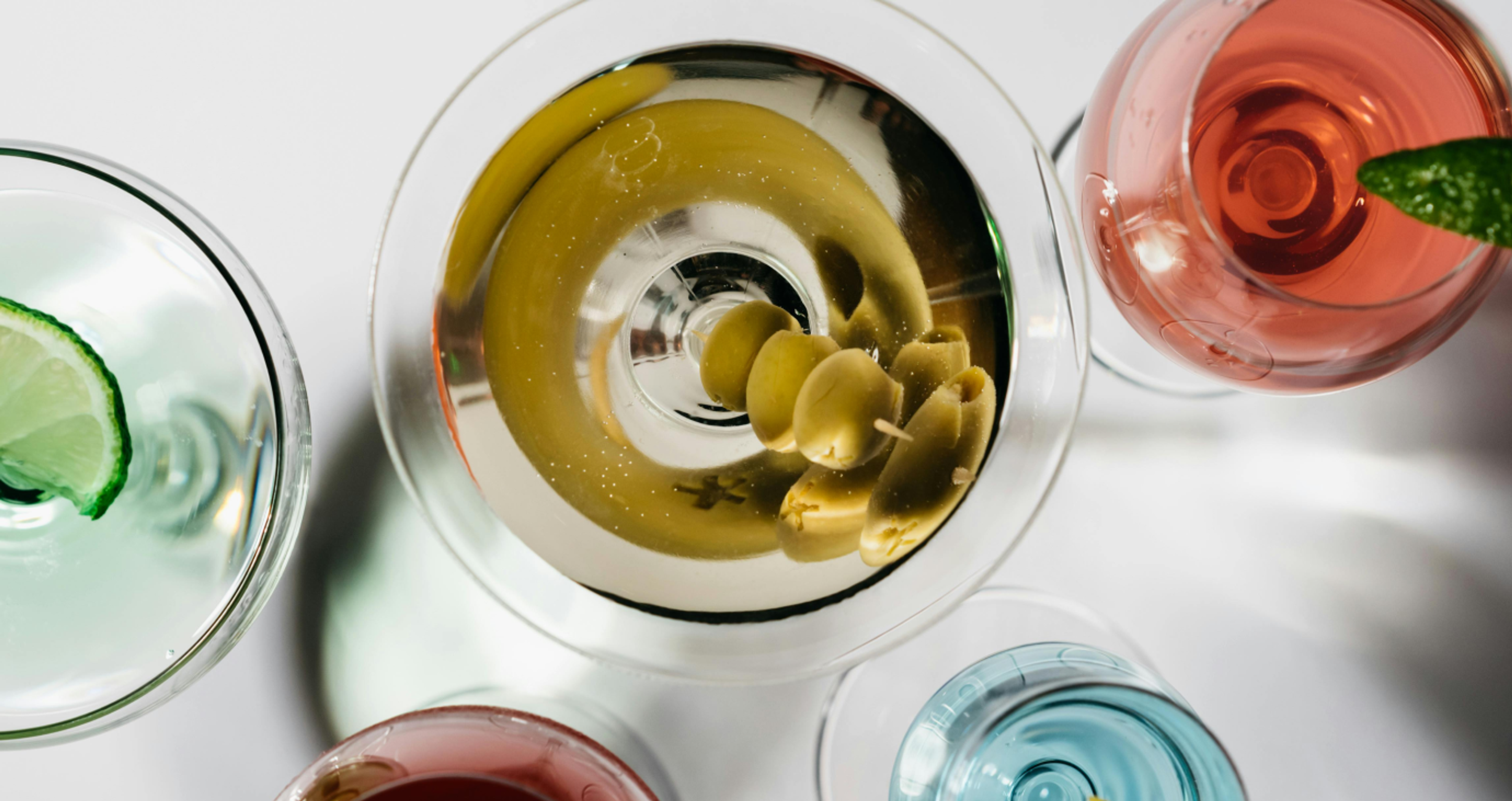 Overhead view of cocktails including a martini and others