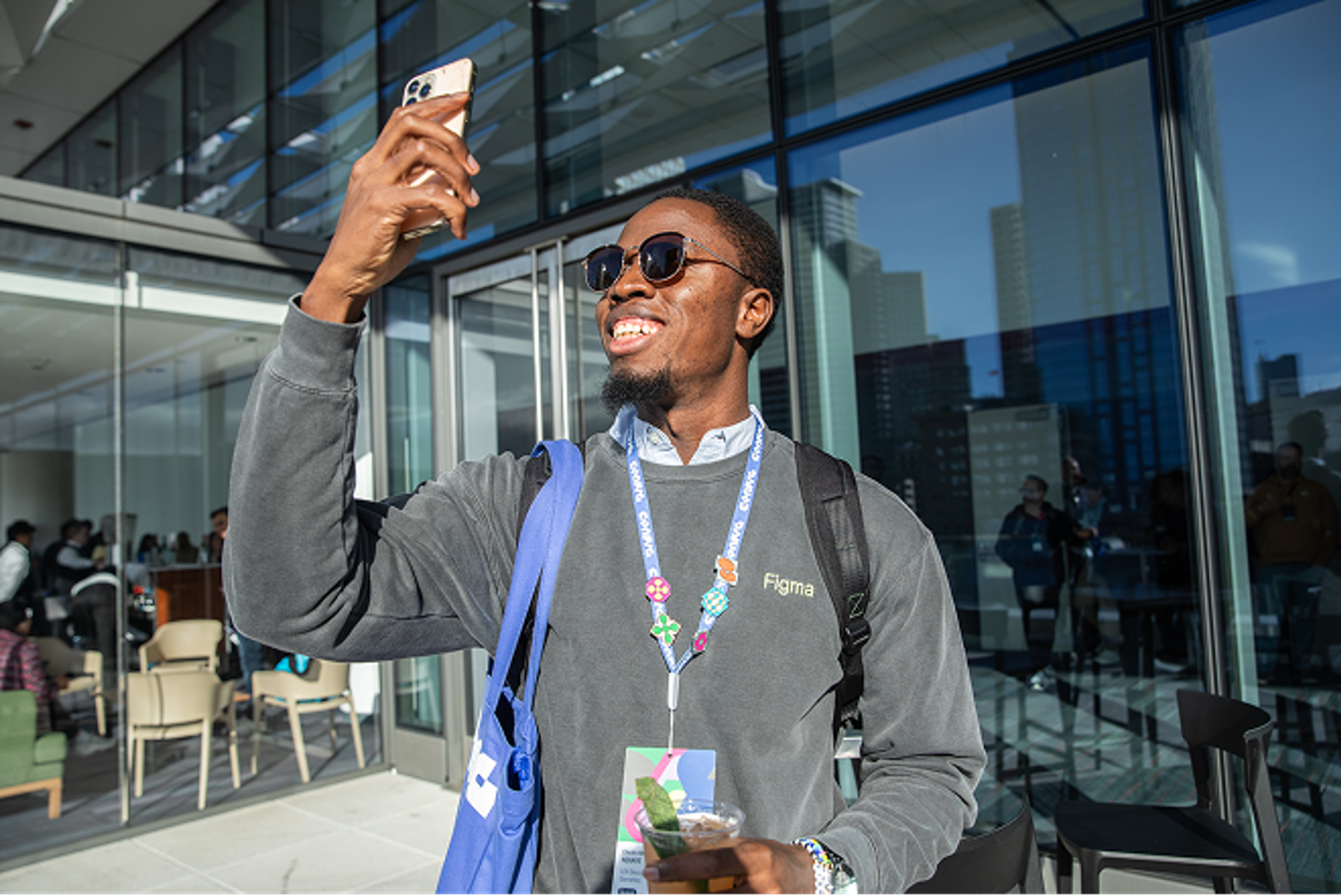 Config attendee outside while smiling for a photo