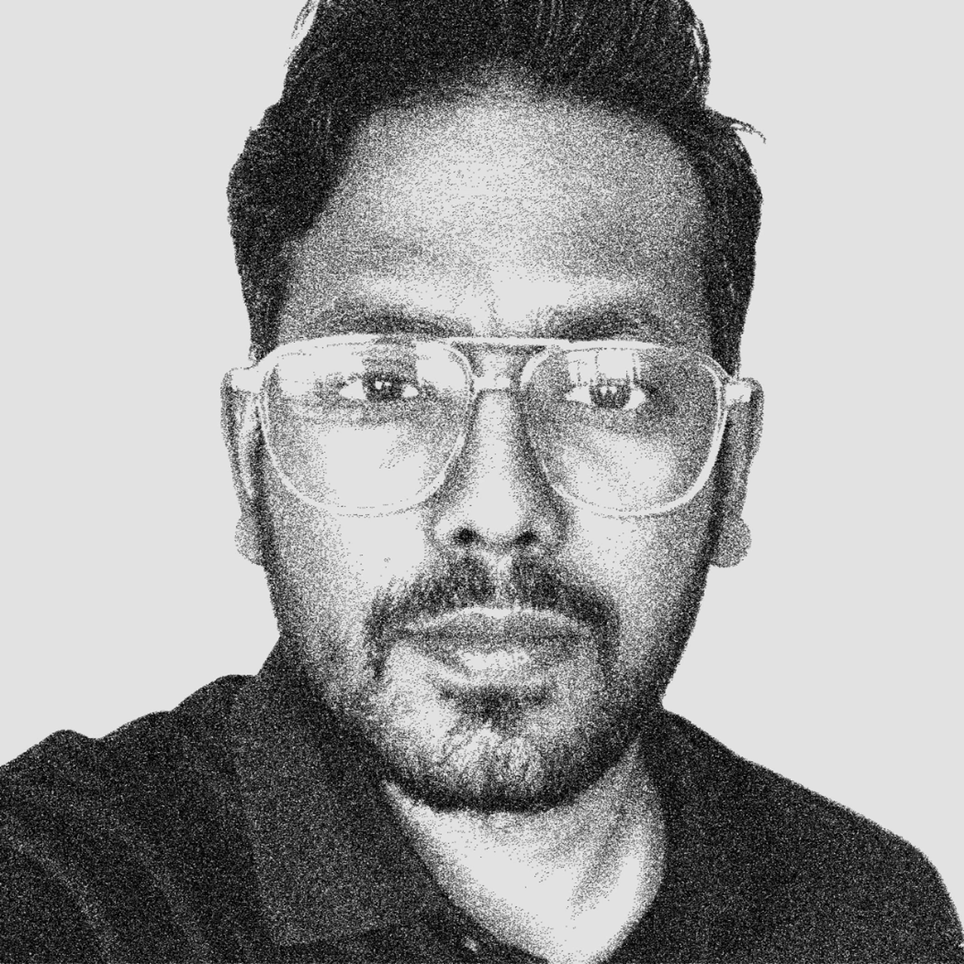 black and white headshot of Unni Manikoth