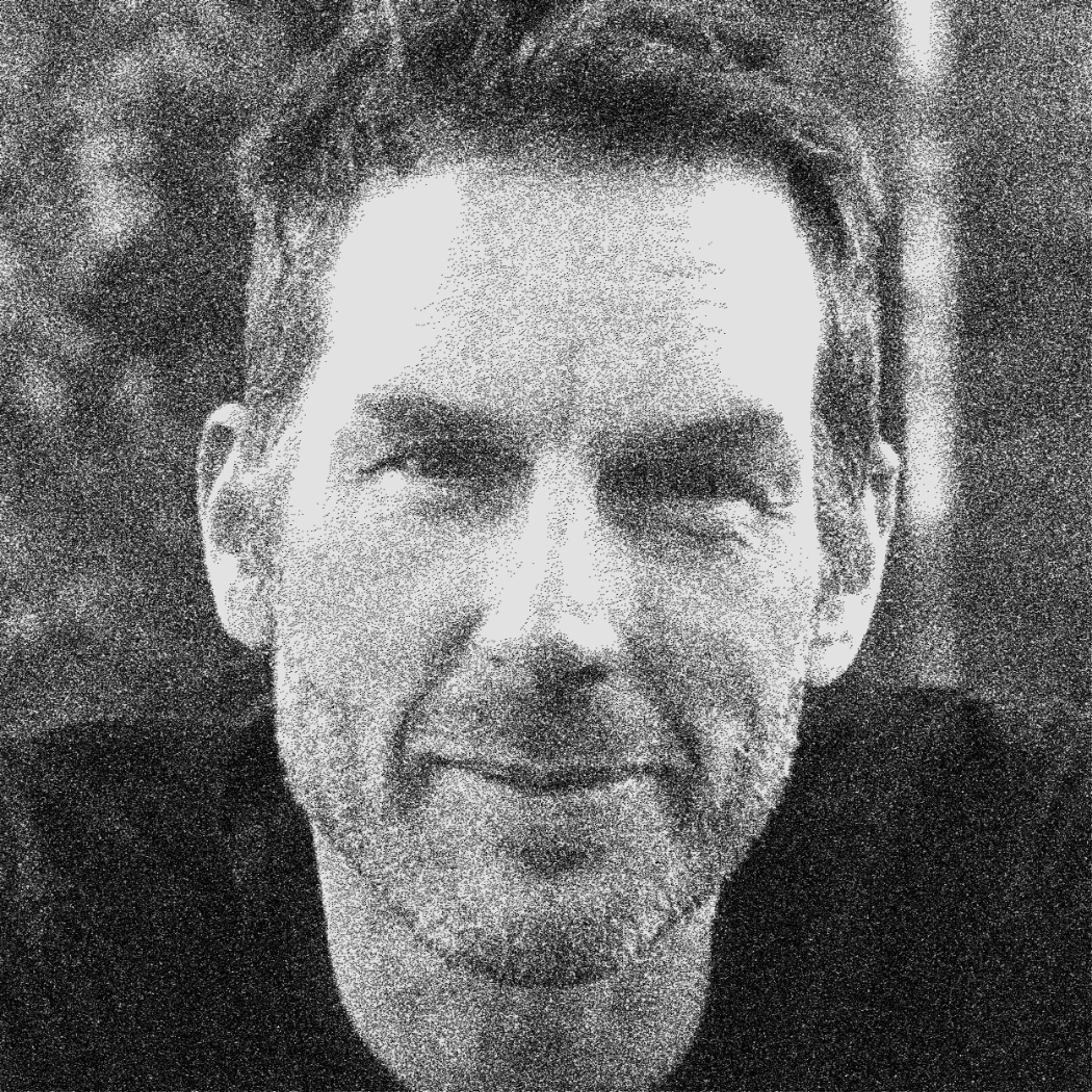 black and white headshot of charlie sutton