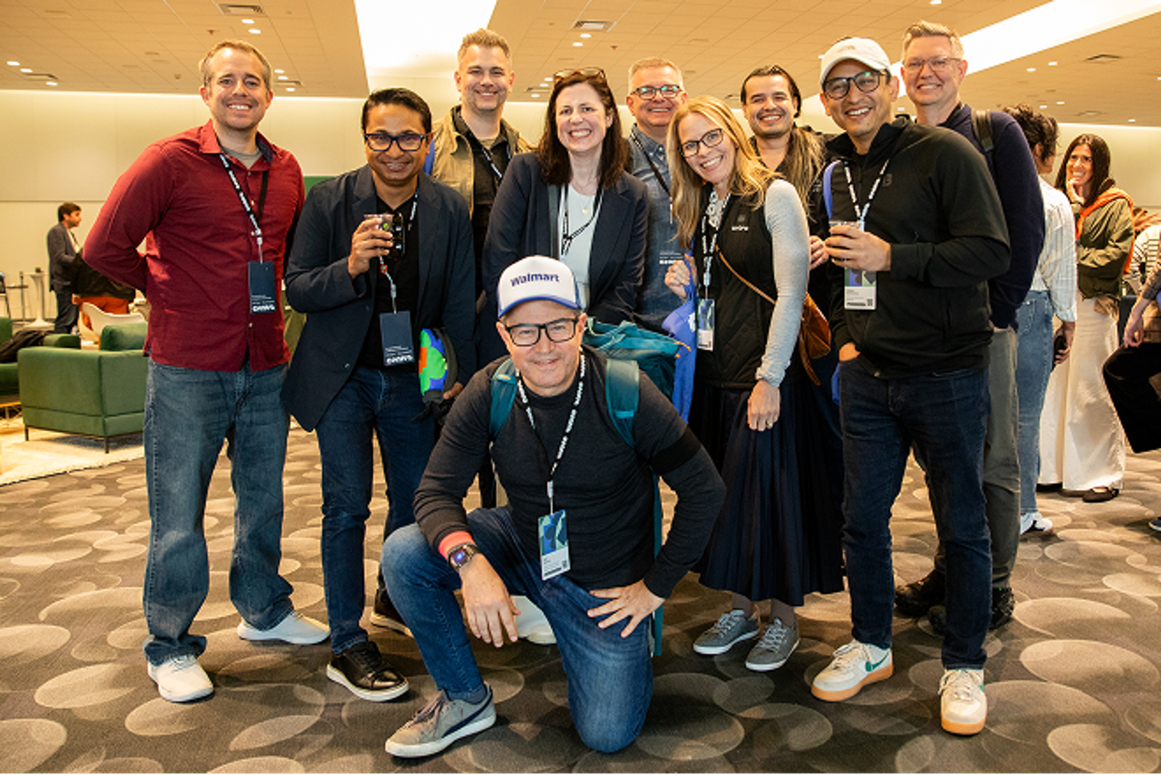 Group of people attending Config smiling while inside