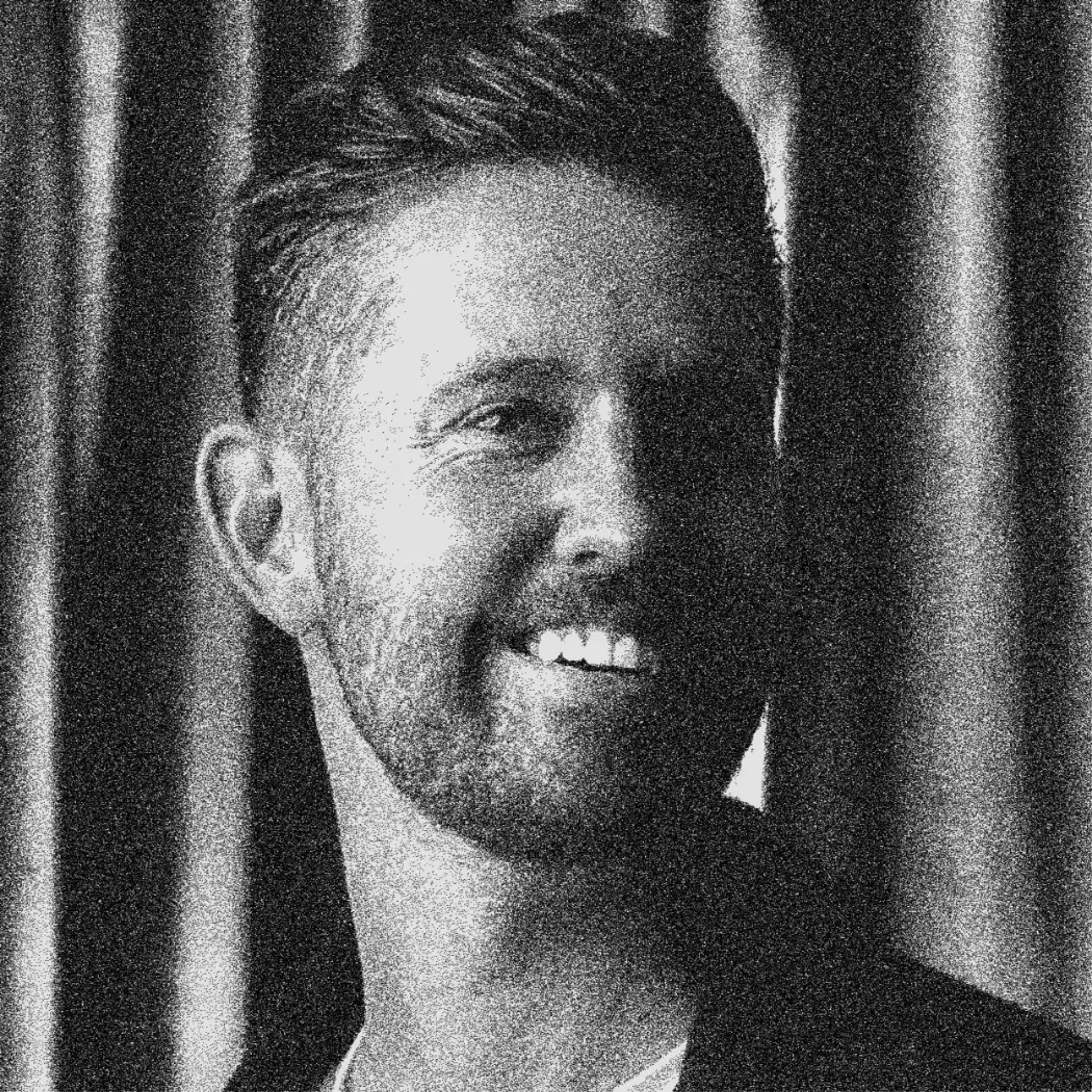 black and white headshot of Chris Warner