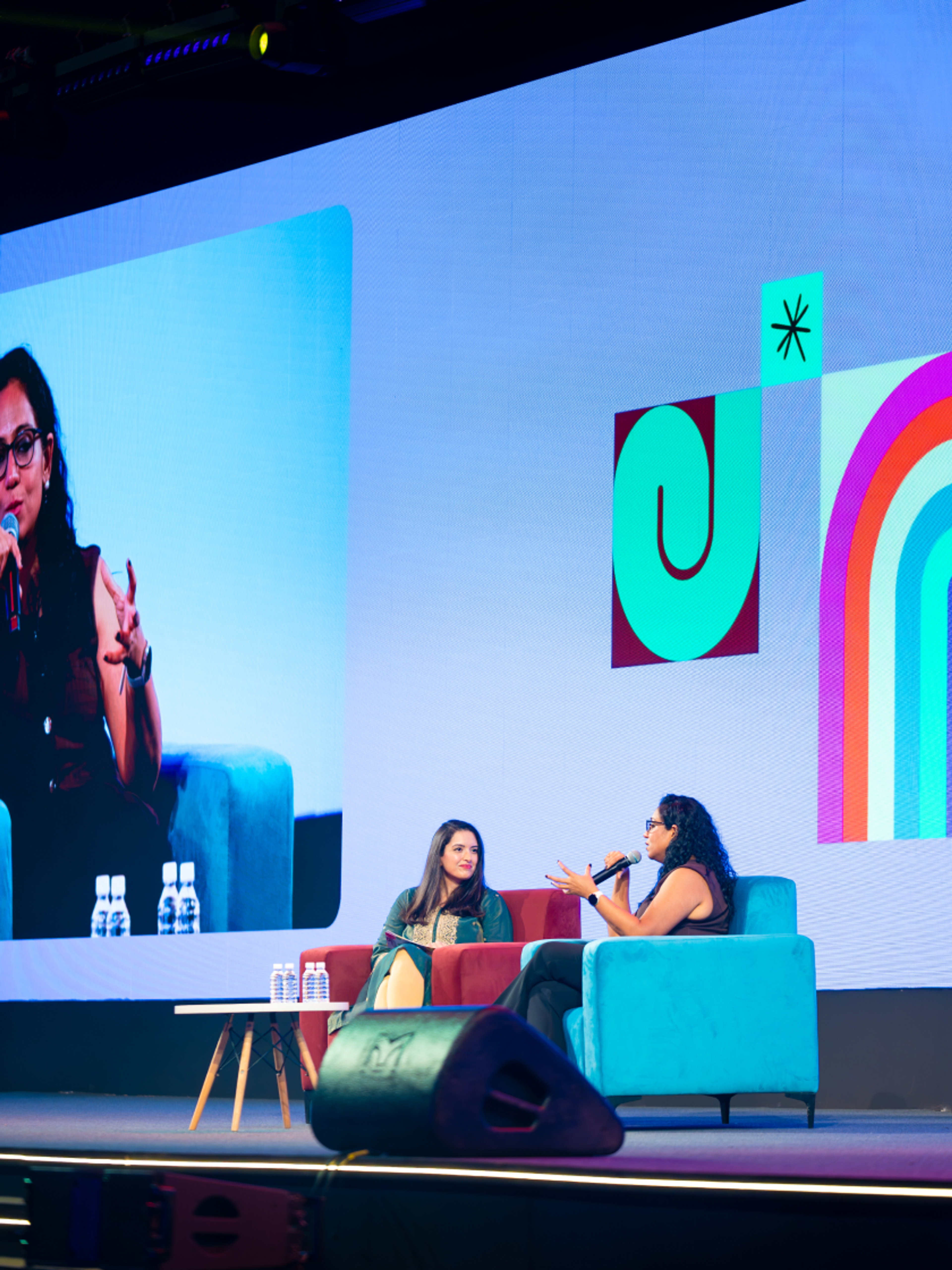 Sheila and female speaker on stage at Config in conversation