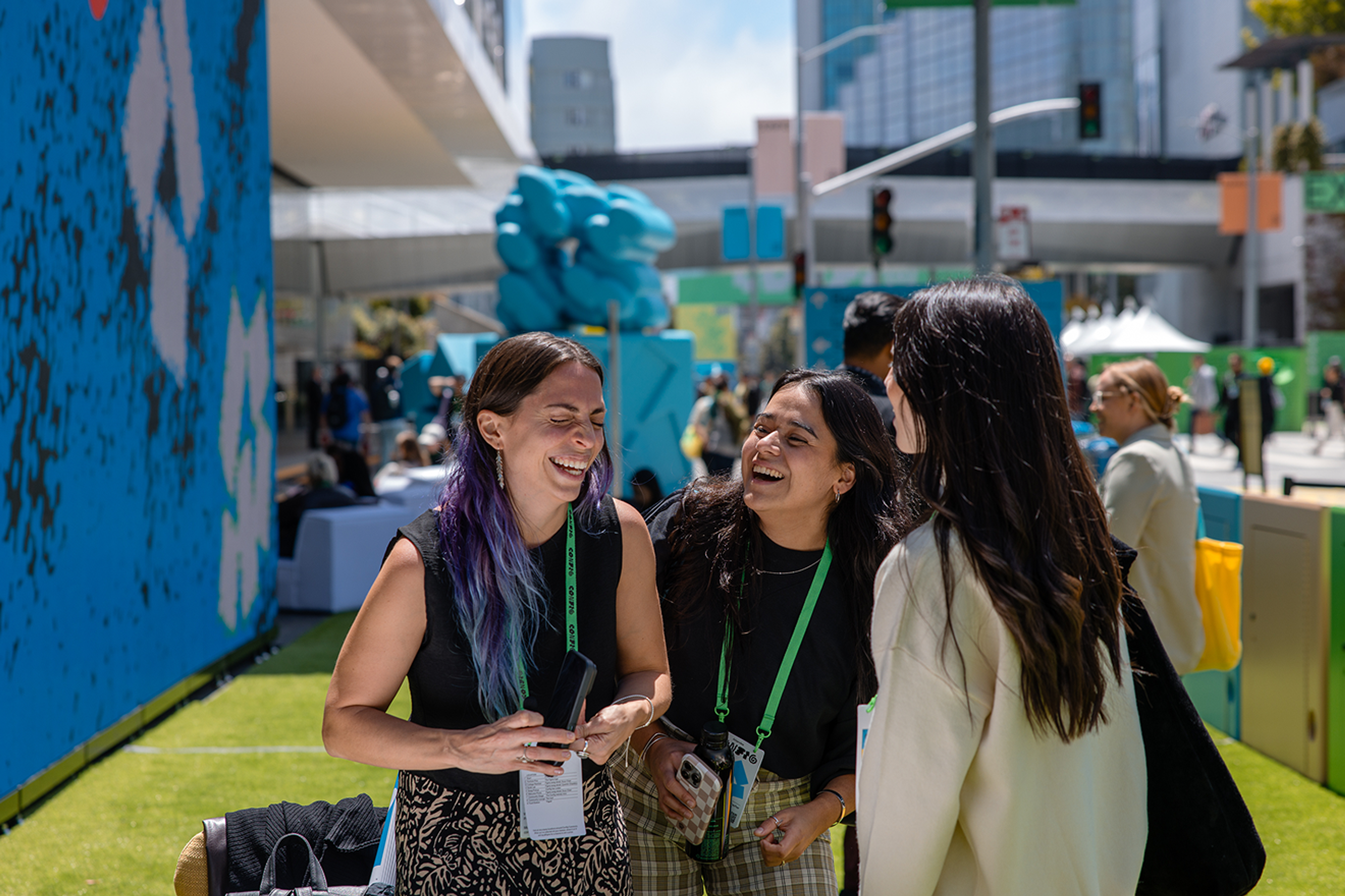 Three Config attendees laughing outside