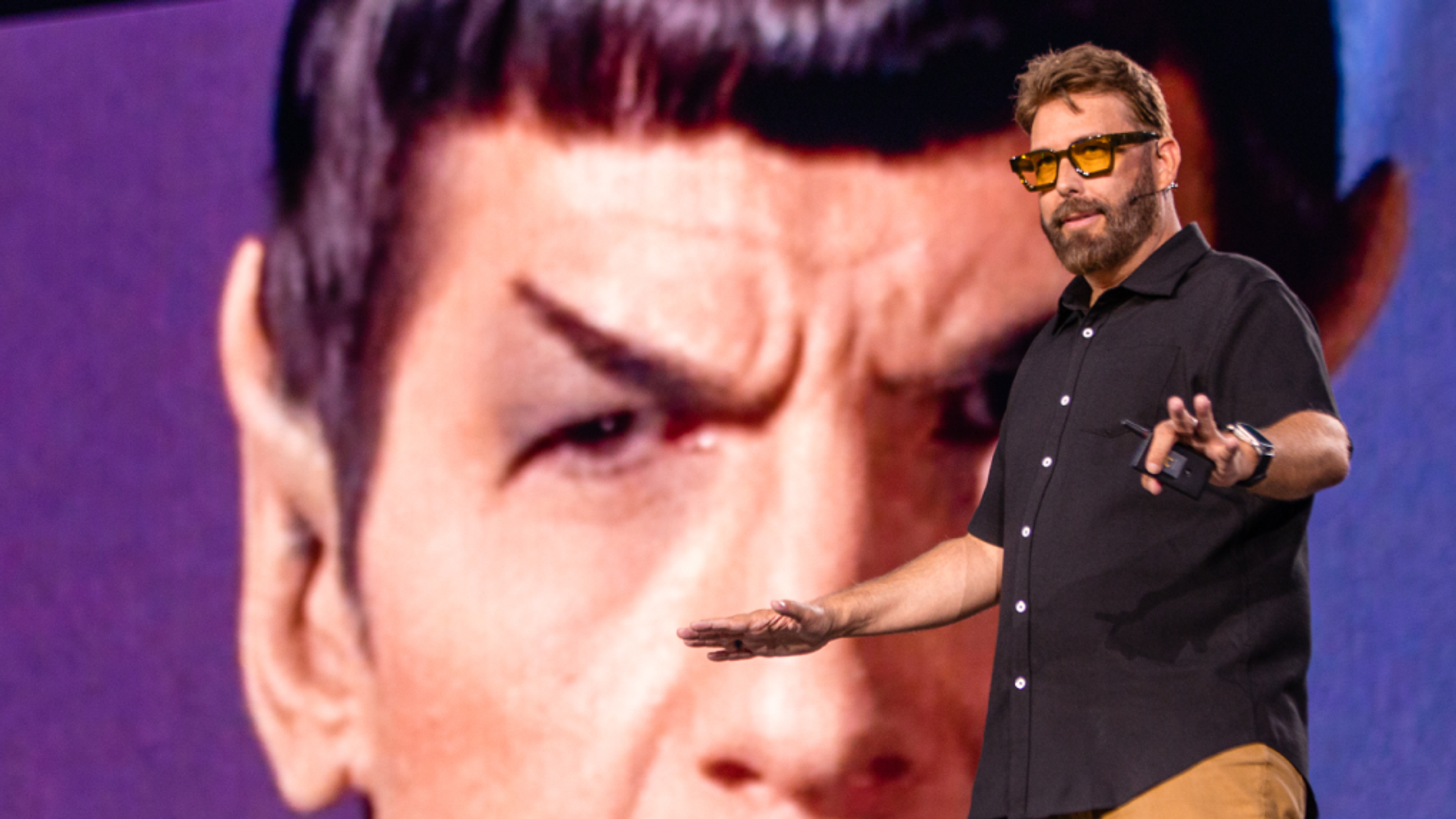 Jayse speaking on stage with Star Trek baackground
