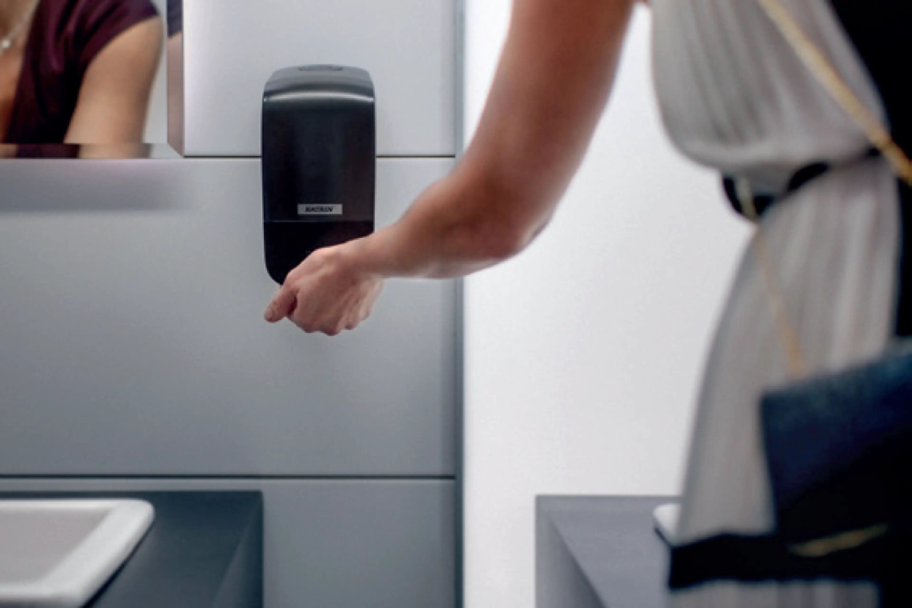 Såpedispenser på offentlig toalett