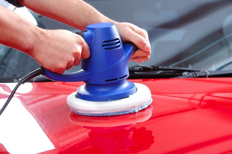 waxing car with orbital polisher