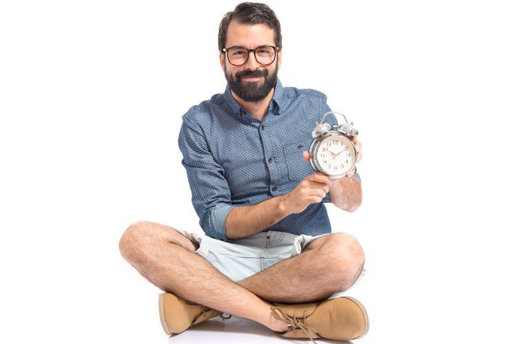 man sitting with a clock