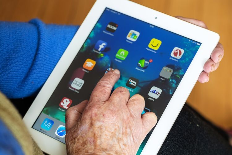 elderly person using an ipad