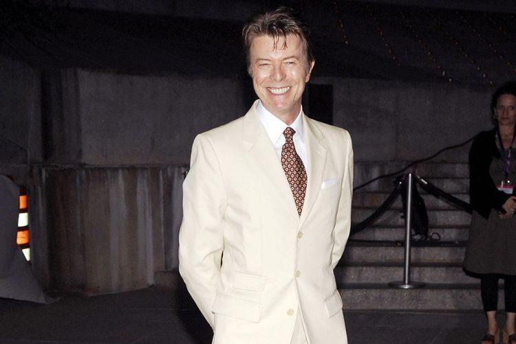 david bowie wearing a white suit