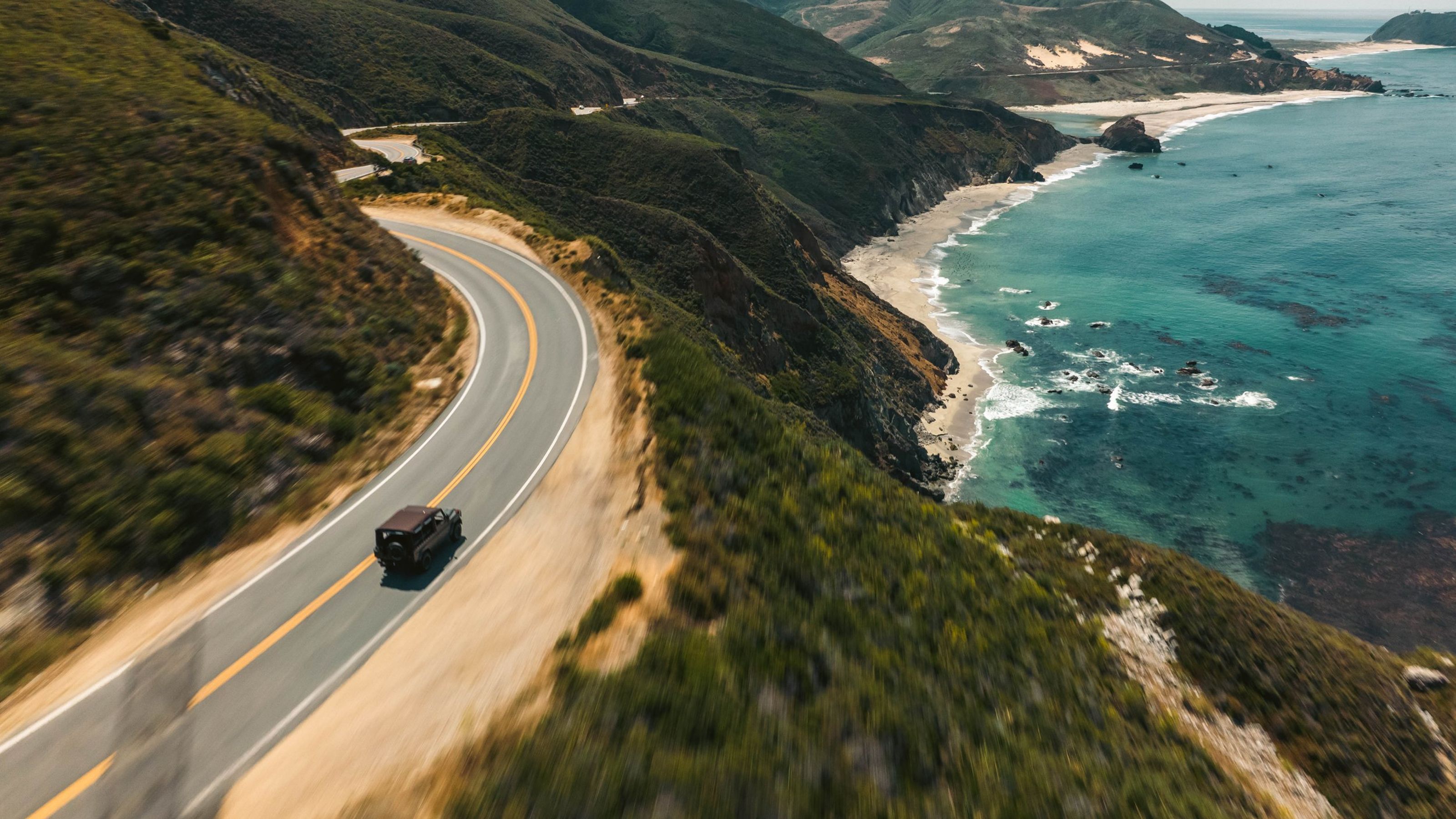 Black Banyan G-Class driving along a coastal road