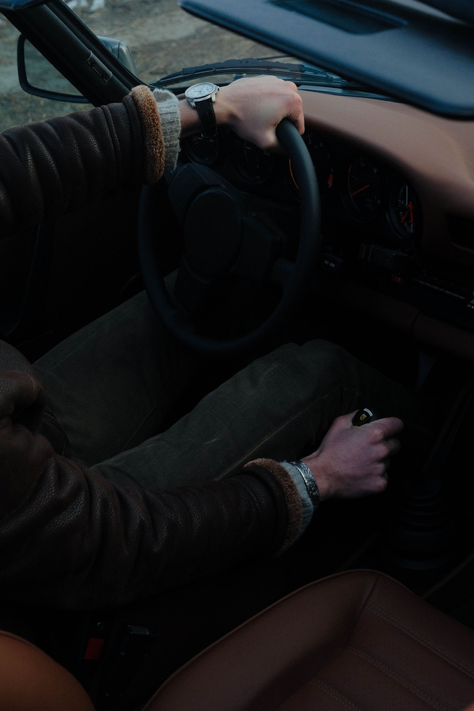 Driver inside a restored classic vehicle