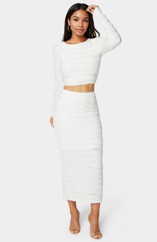 View Bebe Ruffle Lace Long Sleeve Two-Piece Skirt Set in all available color and sizes Picture of Ruffle Lace Long Sleeve Two-Piece Skirt Set