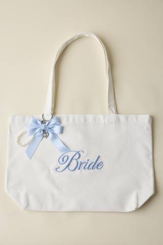 View DB Studio Bride Tote Bag With Bow and Pearl Charm in all available color and sizes Picture of Bride Tote Bag With Bow and Pearl Charm