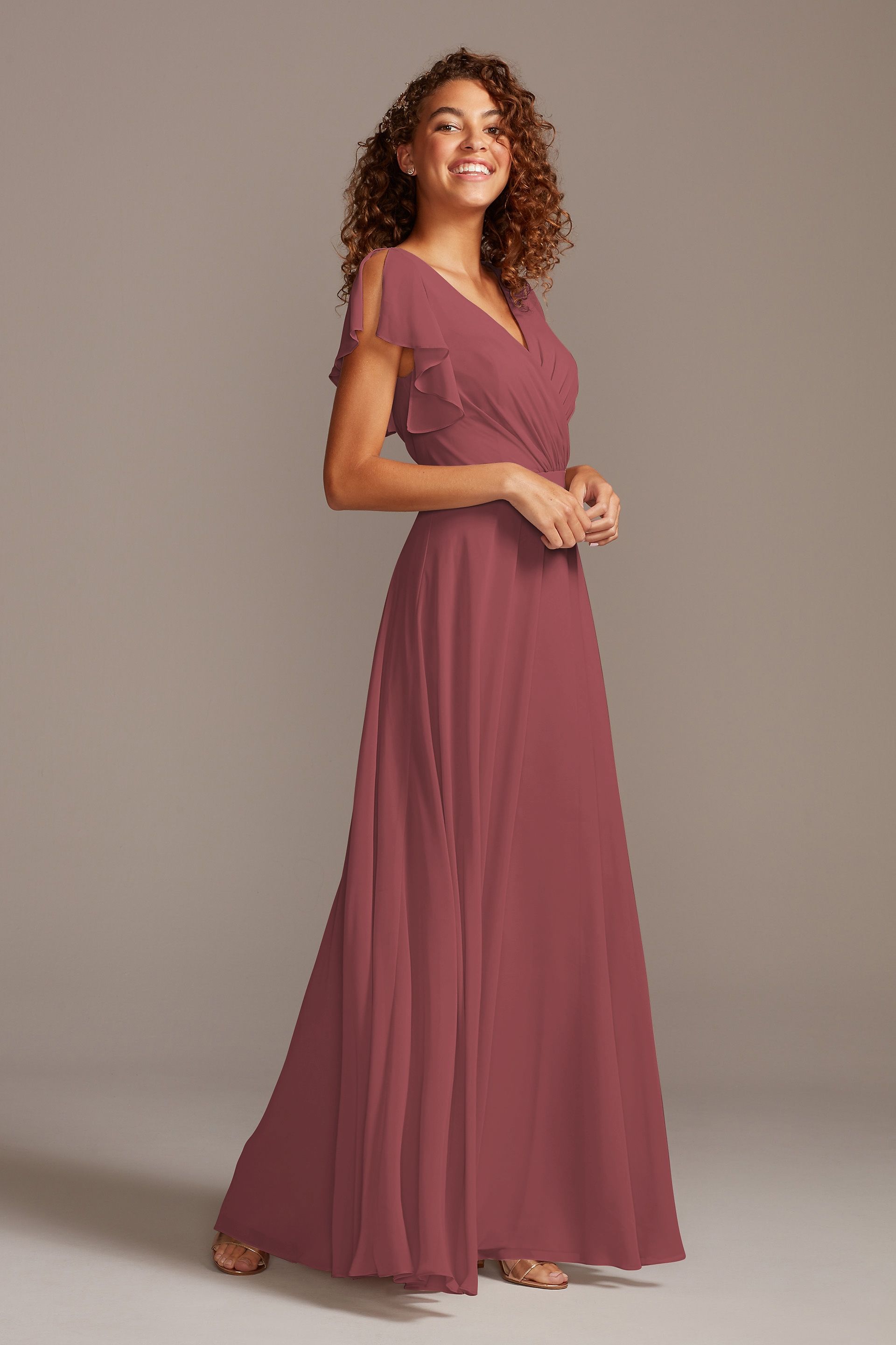 double strap long georgette bridesmaid wrap dress Wedding Gown David's Bridal Flutter Sleeve Bridal Bridesmaid Wrap Georgette David's Bridal David's Bridal Flutter Sleeve Silk Satin Colors:Peach Fuzz 843 Aria Tiered Ruffle Mini layered tulle bridal gown Bride length bridesmaid is styled