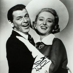 SINATRA, FRANK and HOLM, CELESTE High Society publicity photograph signed by Celeste Holm. A reproduction of a publicity photograph depicting Frank Sinatra and Celeste Holm embracing, signed in black ink by Ms. Holm over her image. 8 x 10 inches. Fine.