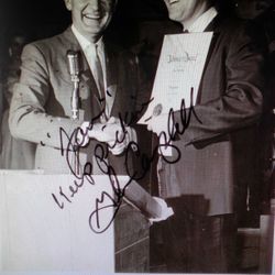 Singer Glenn Campbell accepting Jan's circa1964 award for Los Angeles Country drummer of the year. Seen with Glenn is T. Texas Tyler. Jan was working :).