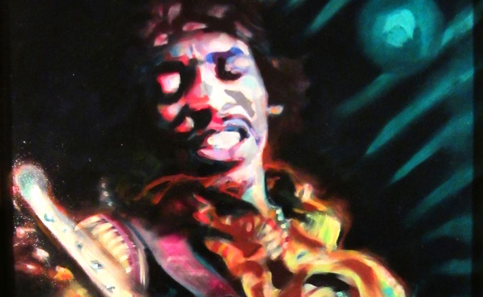 Jimi Hendrix på scenen med gitar